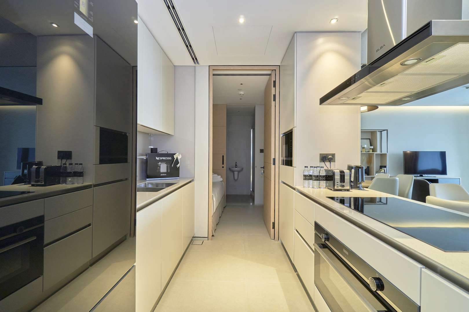 Fully furnished living room in Jumeirah Beach apartment with modern decor and large windows