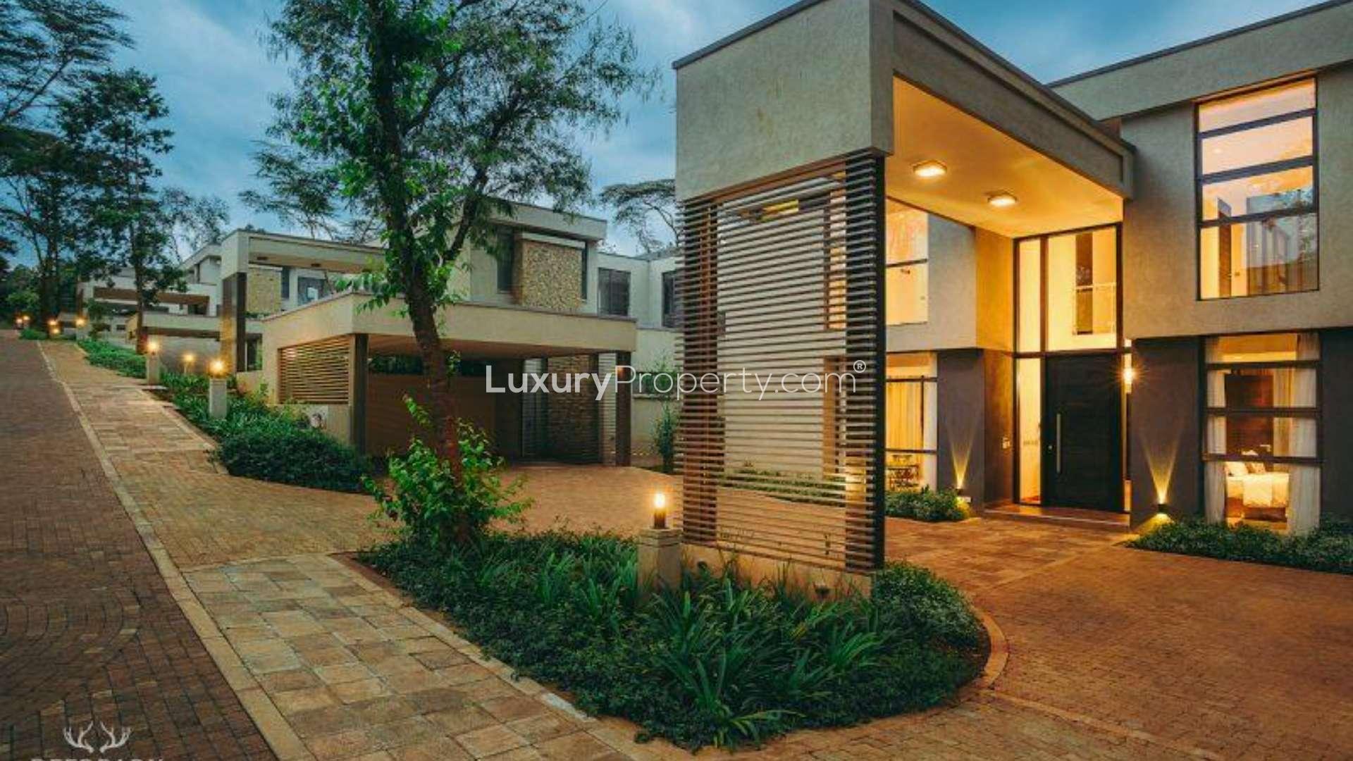 Modern five-bedroom villa exterior in Karen, Nairobi, surrounded by lush greenery