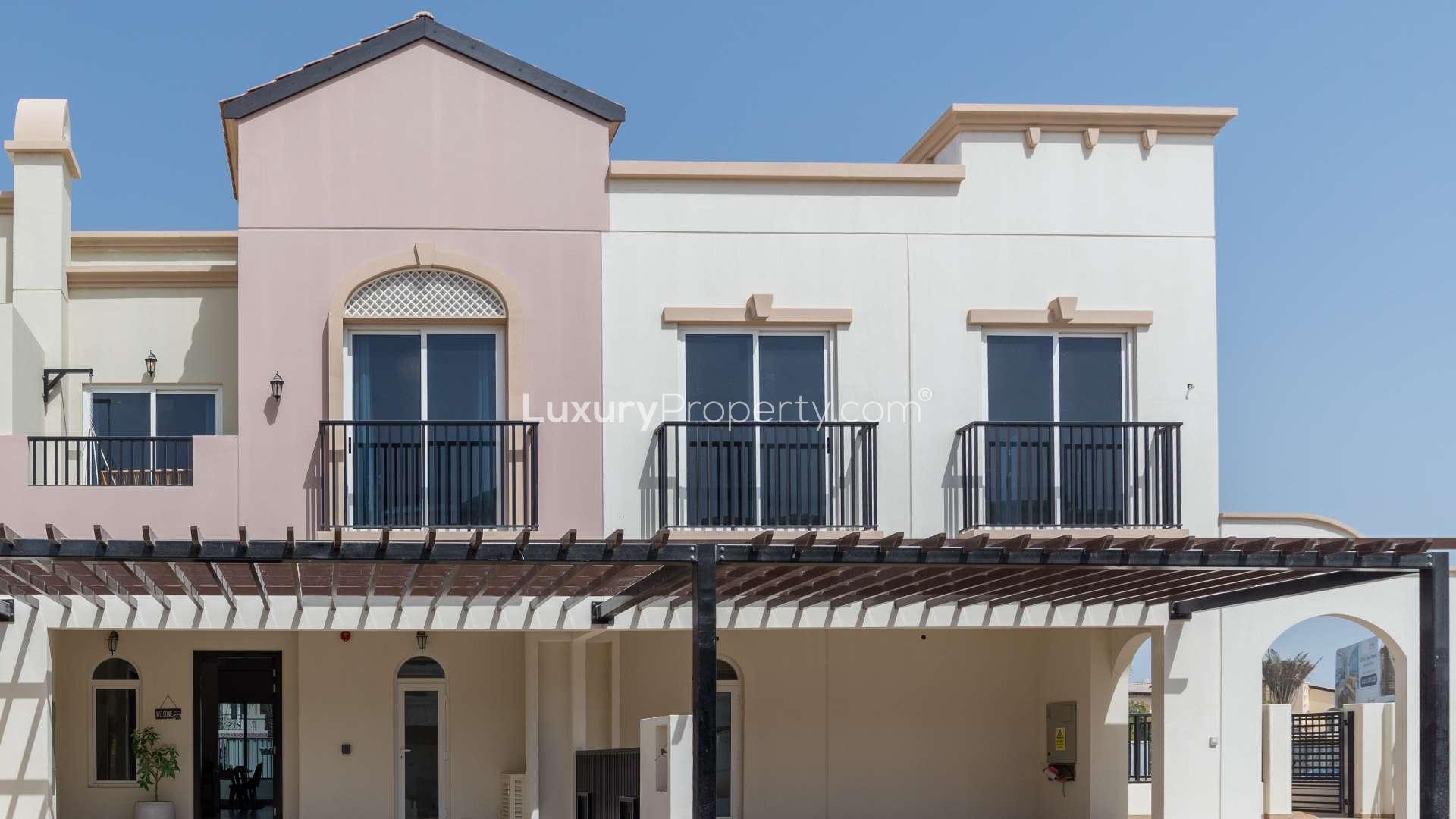 "Bright interior room with air conditioning in Zafran Townhouses, Jumeirah Golf Estates for sale.",Modern two-bedroom townhouse exterior in Zafran, Jumeirah Golf Estates, available for sale