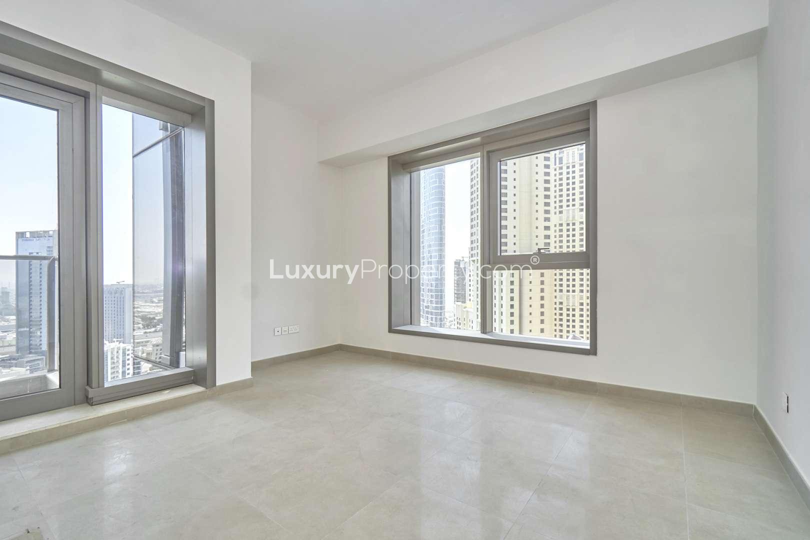 Empty room with large windows and marina view in Sparkle Towers, Dubai Marina