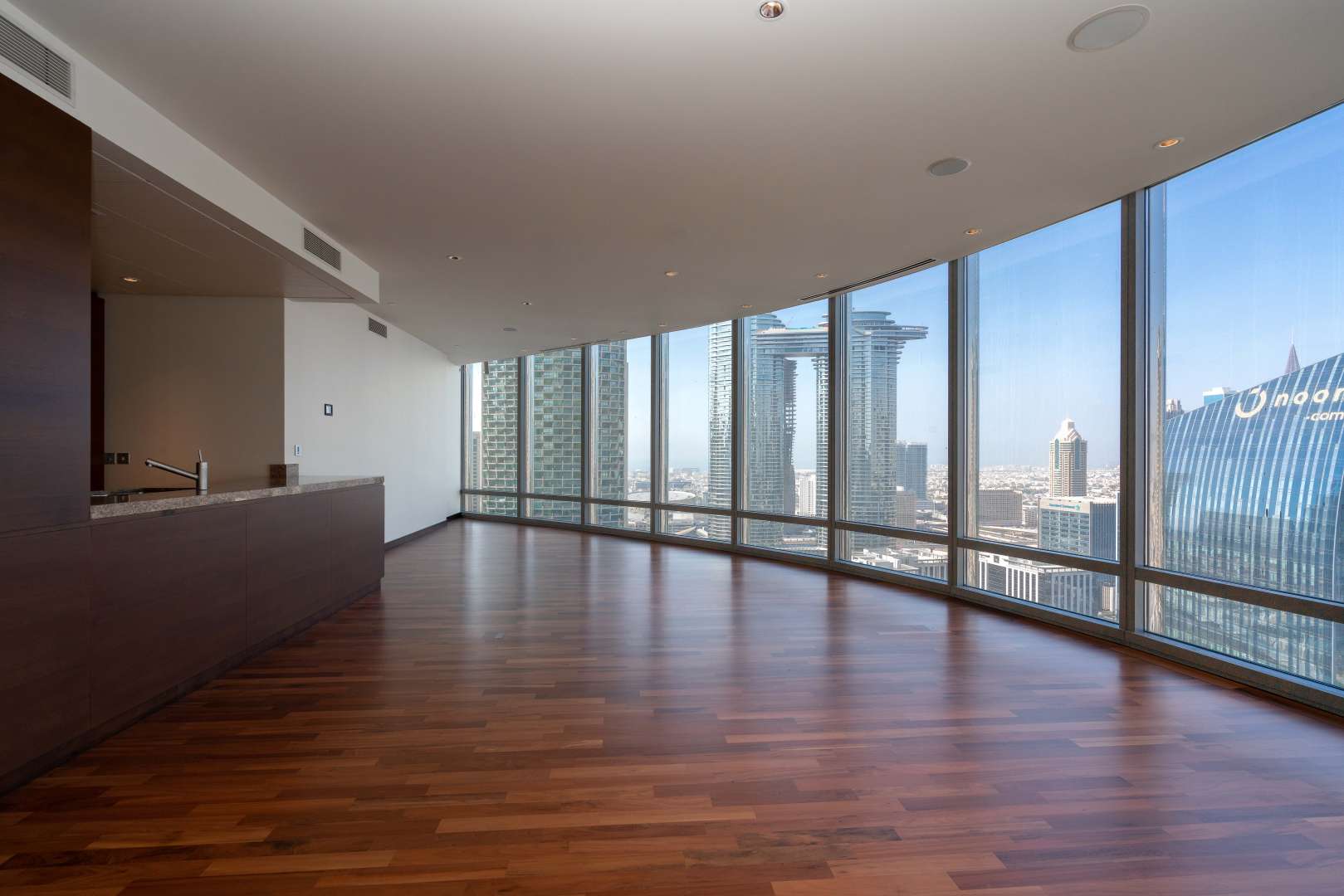 Spacious living area with panoramic windows in Burj Khalifa apartment, Downtown Dubai