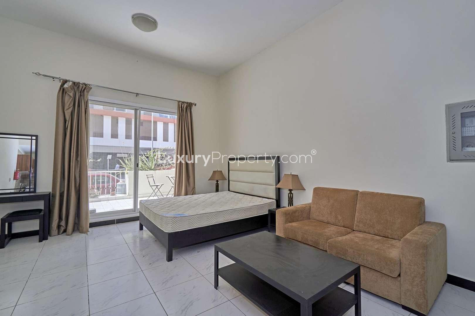 Exterior view of Knightsbridge Court apartment building in Jumeirah Village Circle, Dubai