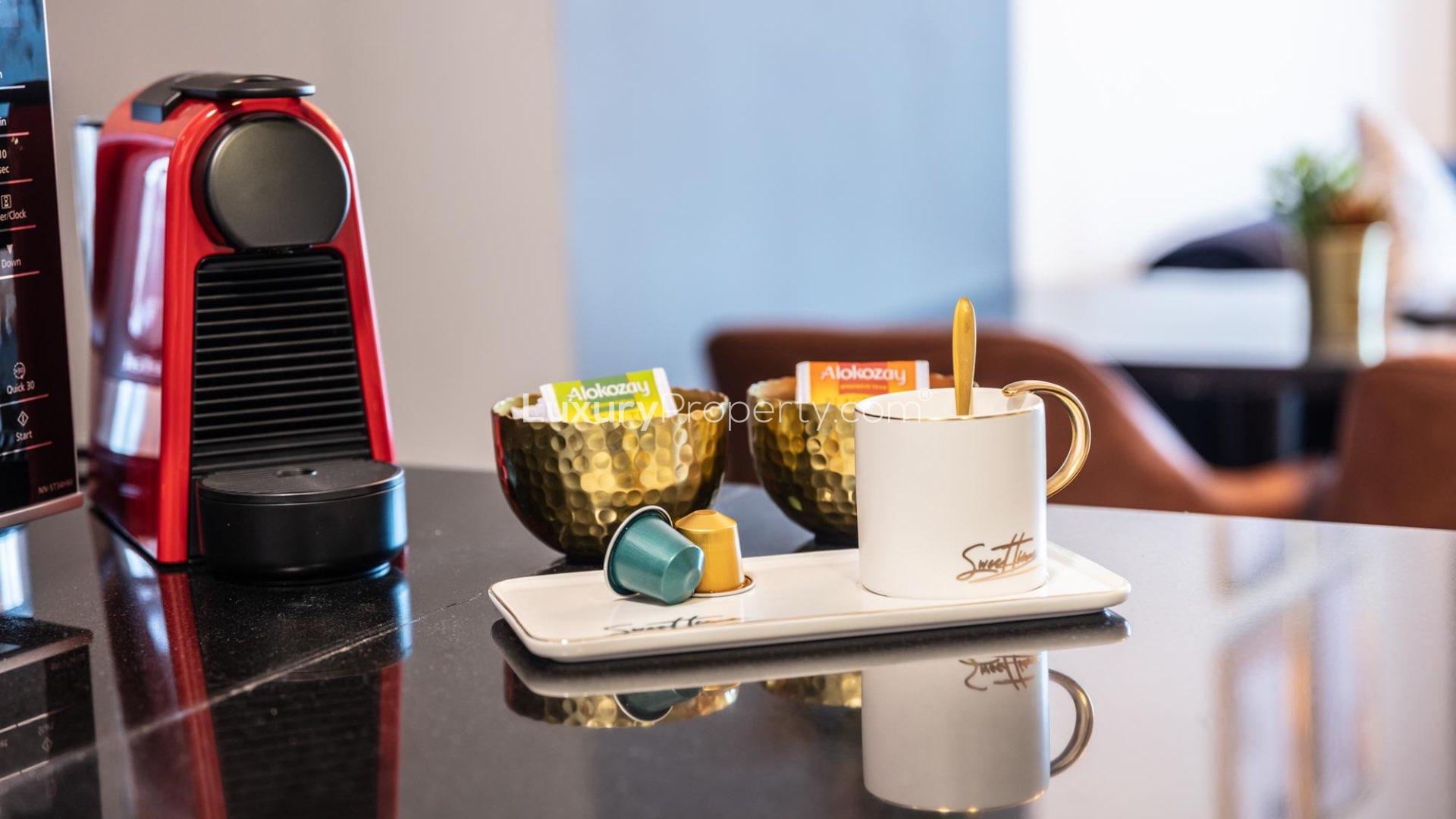 Dubai Marina skyline and waterfront view at night, highlighting luxury apartments and yachts