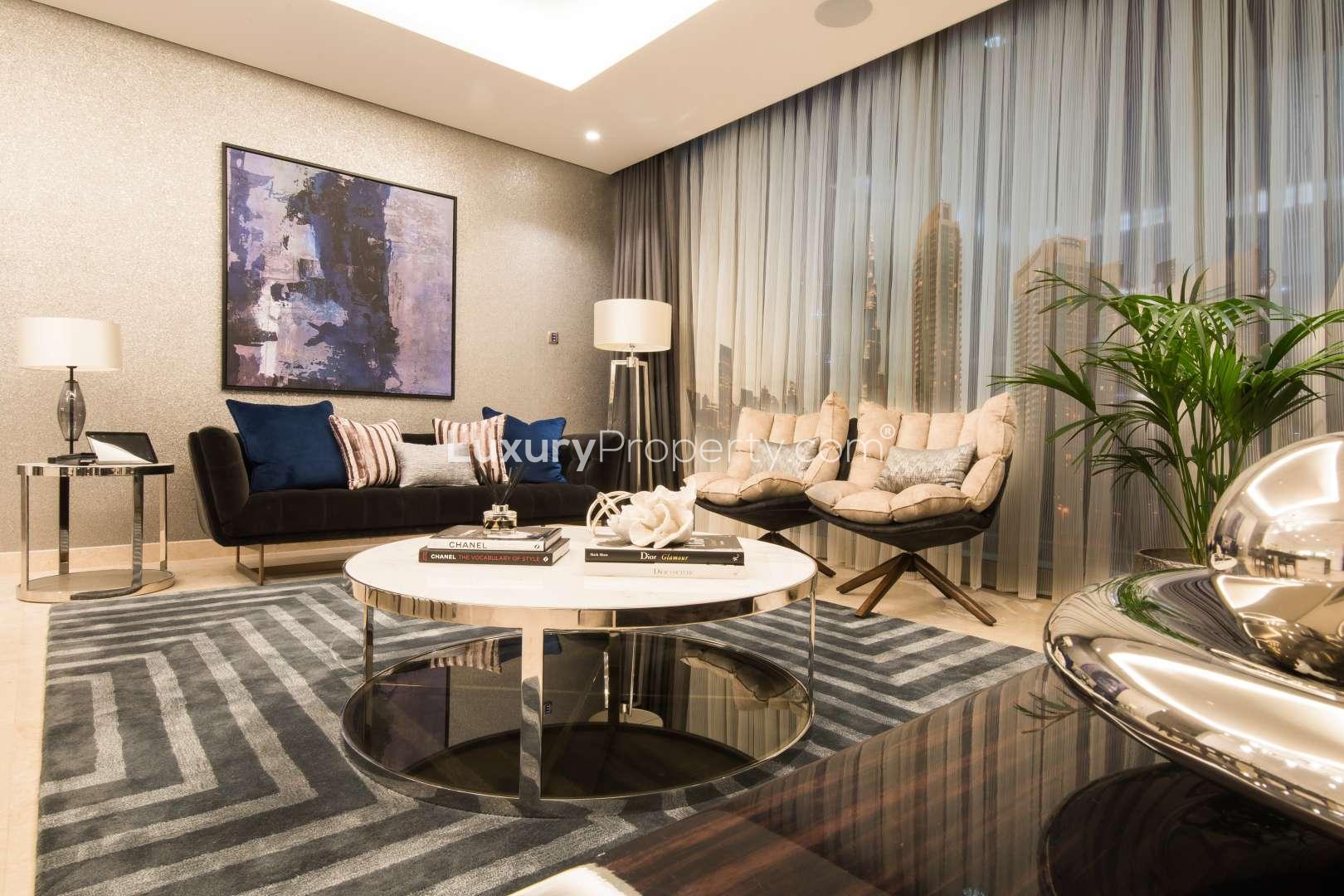 Luxurious bedroom in The Sterling apartment, Business Bay, overlooking Dubai Canal skyline