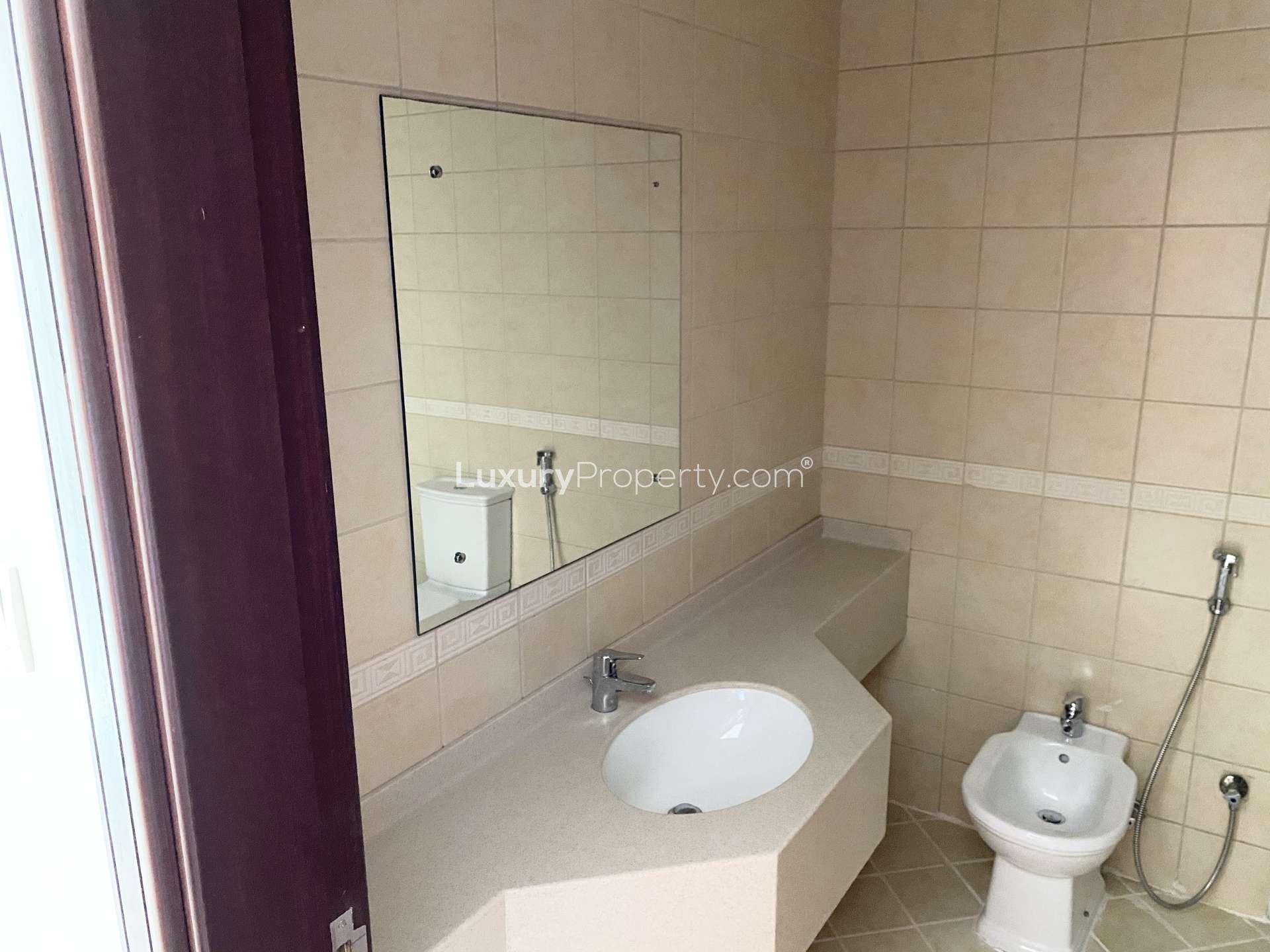 Empty bedroom with built-in wardrobe in Olympic Tower 2, Dubai Sports City apartment for rent