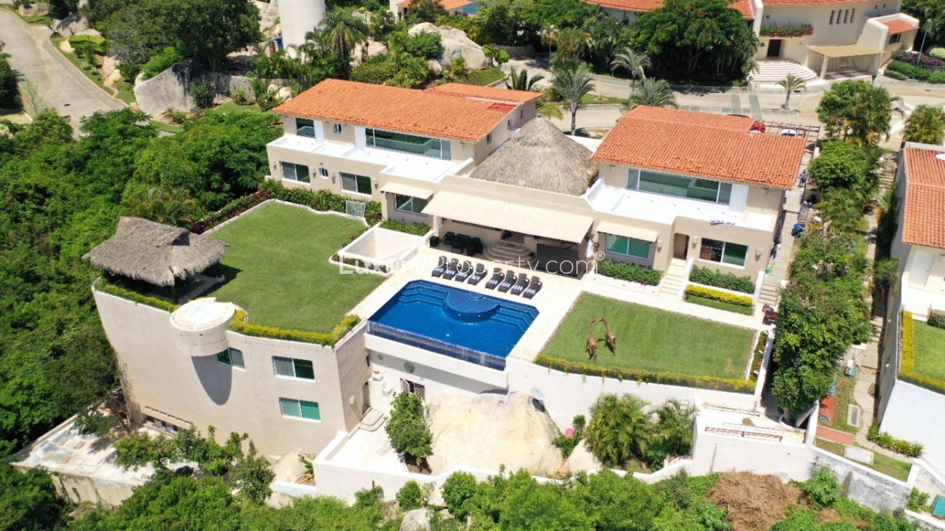 N/A,Aerial view of luxurious Villa Capricho in Acapulco with pool and lush surroundings