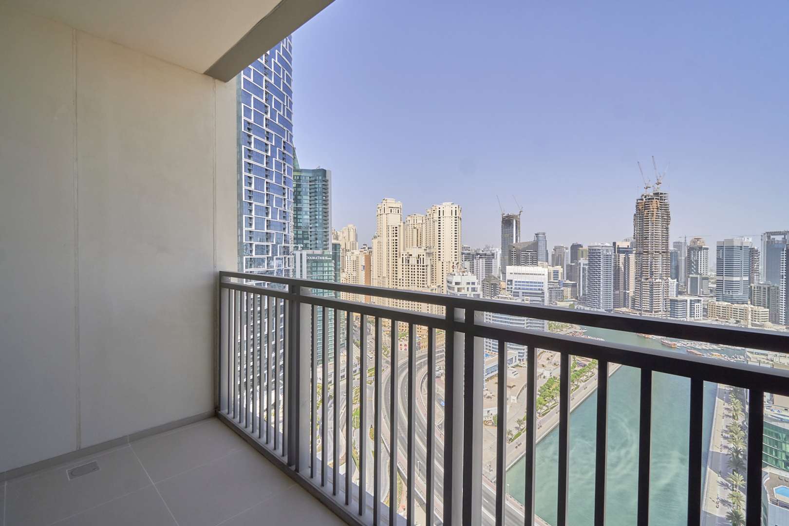 Modern bathroom in 3-bedroom apartment, 52|42 Dubai Marina, featuring glass shower and marble sink