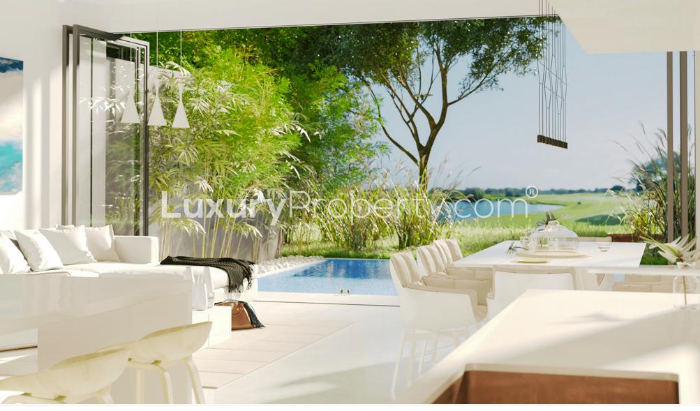 Luxurious Jumeirah Hills villa exterior at sunset, waterfront view, Umm Suqeim, Dubai