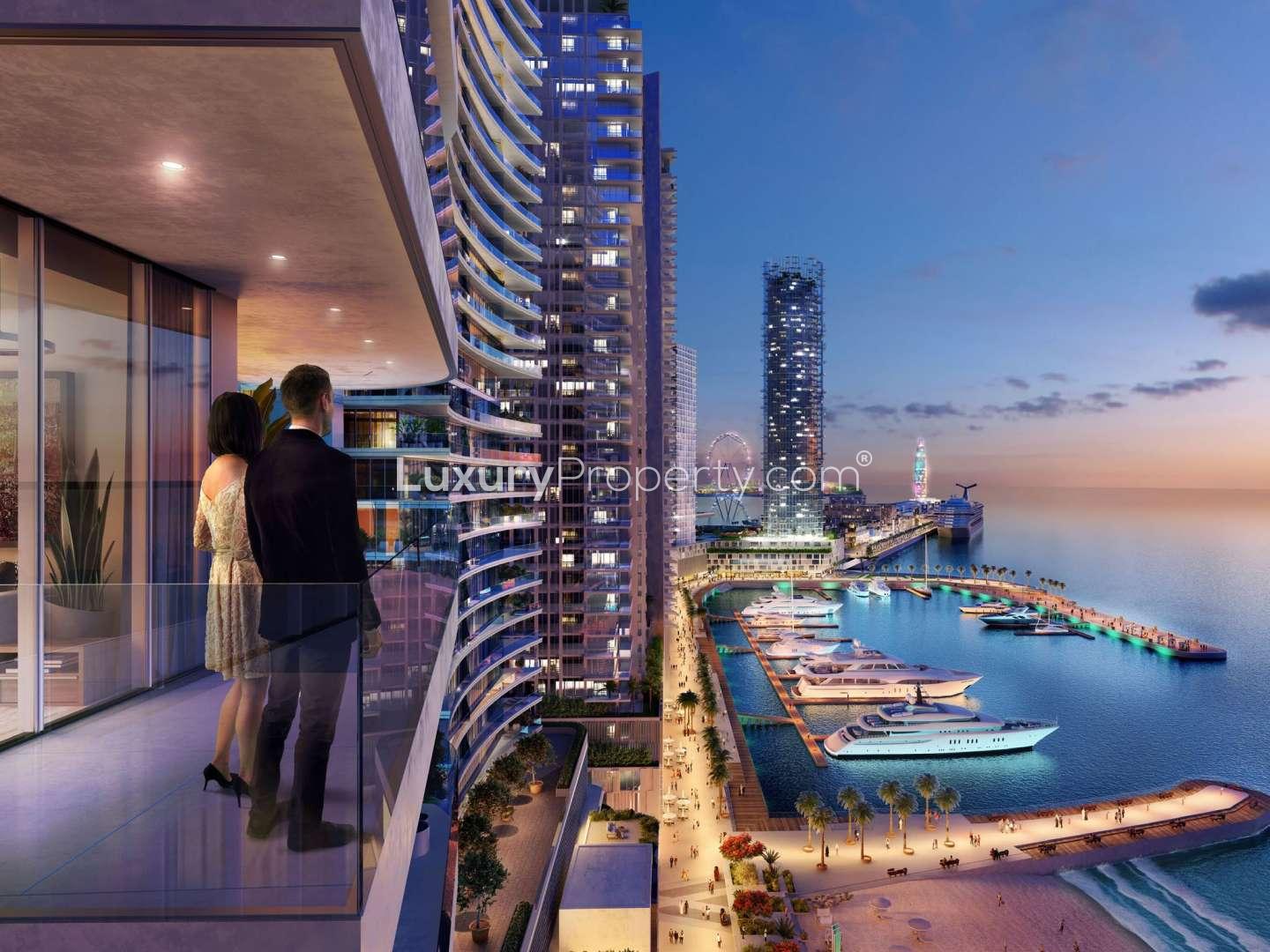 Two-bedroom apartment balcony view of Dubai Harbour marina at sunset, Emaar Beachfront