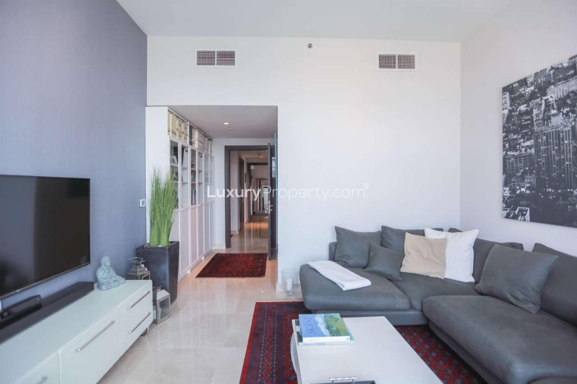 Bright bedroom in upgraded Dubai Canal penthouse with modern decor and large window