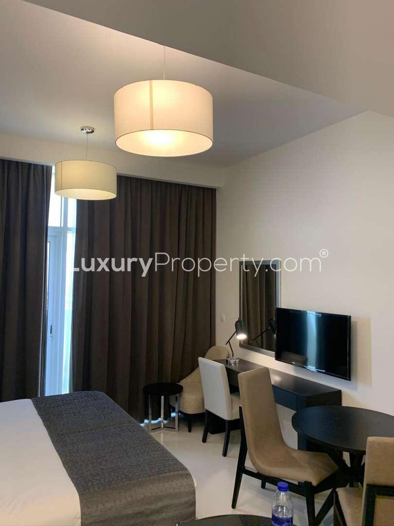 Studio apartment interior in Al Barsha, Jumeirah Village Circle, with modern furnishings and decor
