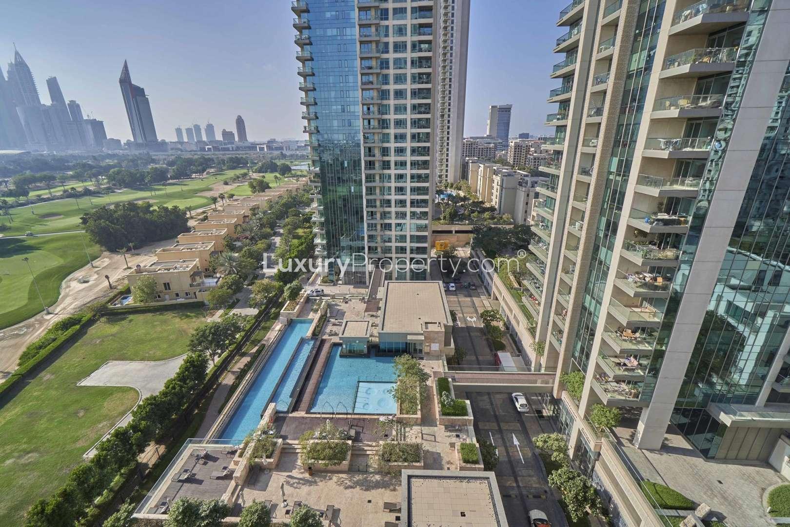 Aerial view of The Fairways apartments with pool and cityscape in The Views