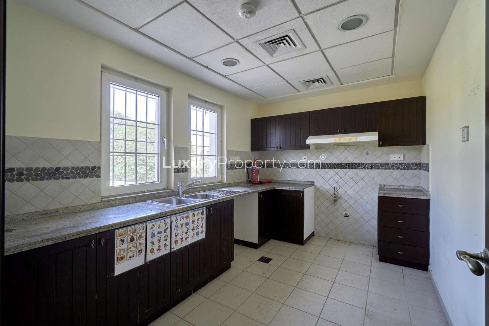 Kitchen with modern fittings in Layan Community townhouse, Dubai Land, available for rent