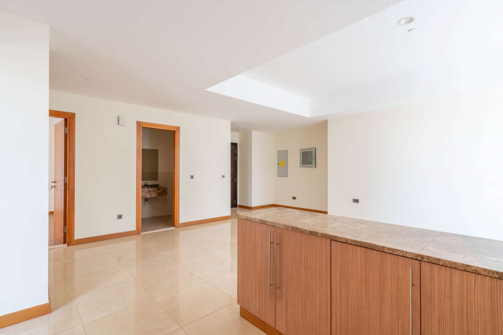 Open-plan kitchen and living area in Al Murad Tower apartment, Al Barsha 1