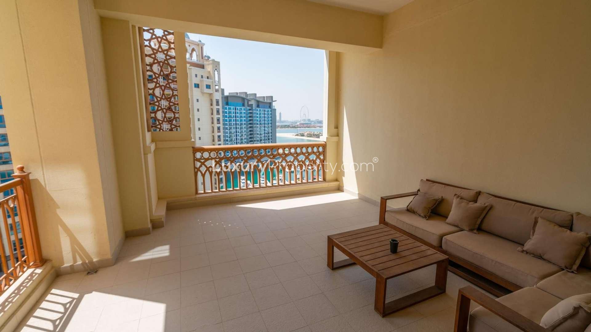 "Modern bathroom and wooden closet in Palm Jumeirah apartment for rent, Marina Residences.",Furnished balcony with sea view in Palm Jumeirah apartment for rent, Marina Residences
