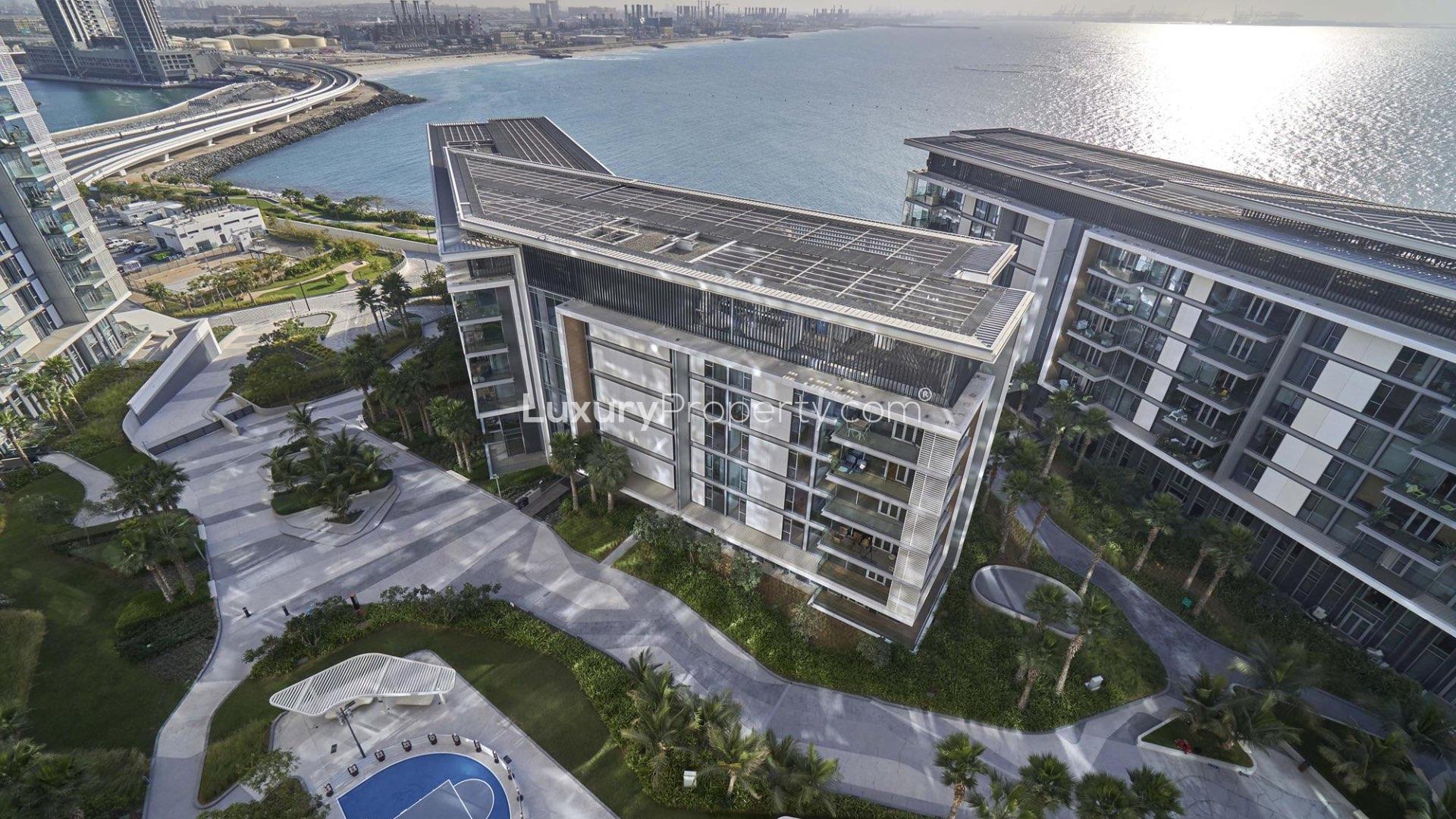 Modern living room in Bluewaters Island apartment with large windows and stylish decor