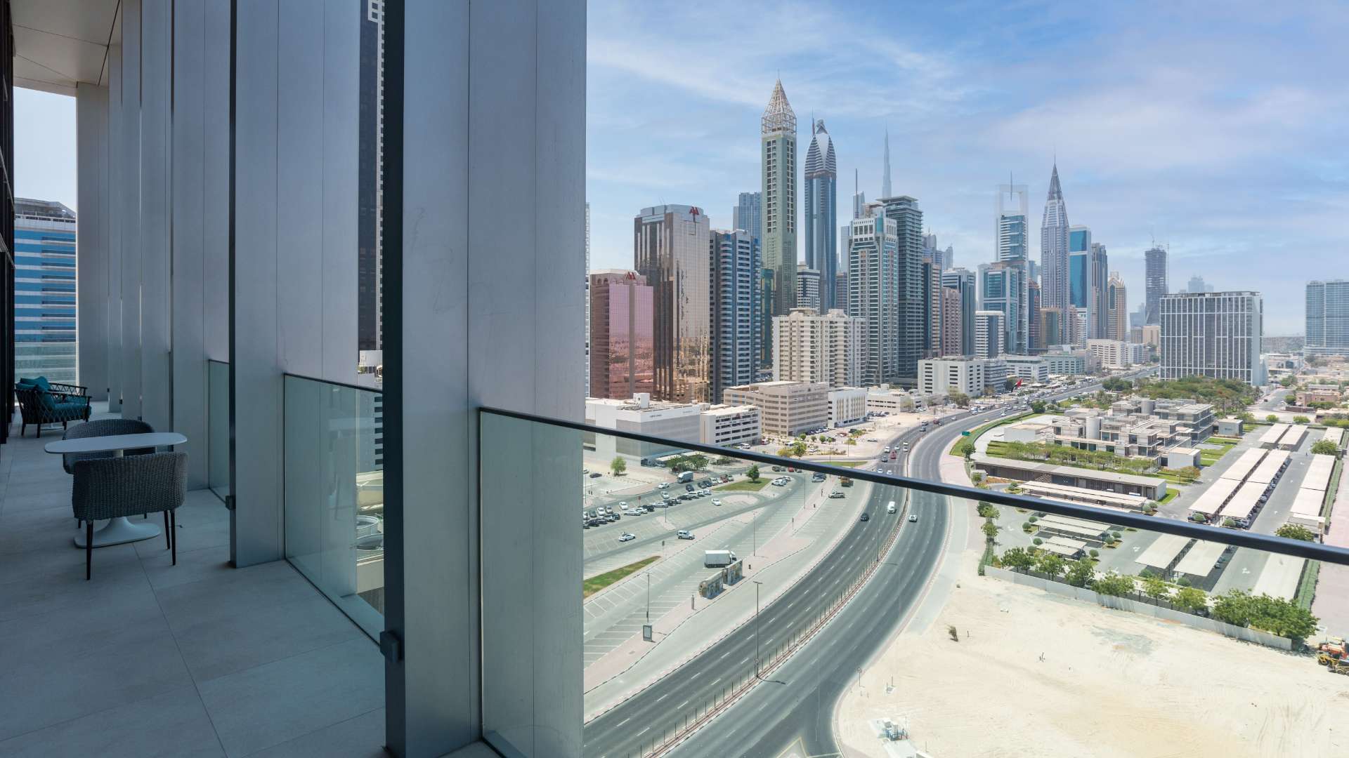 Bright bedroom with balcony view in Eden House apartment on Sheikh Zayed Road