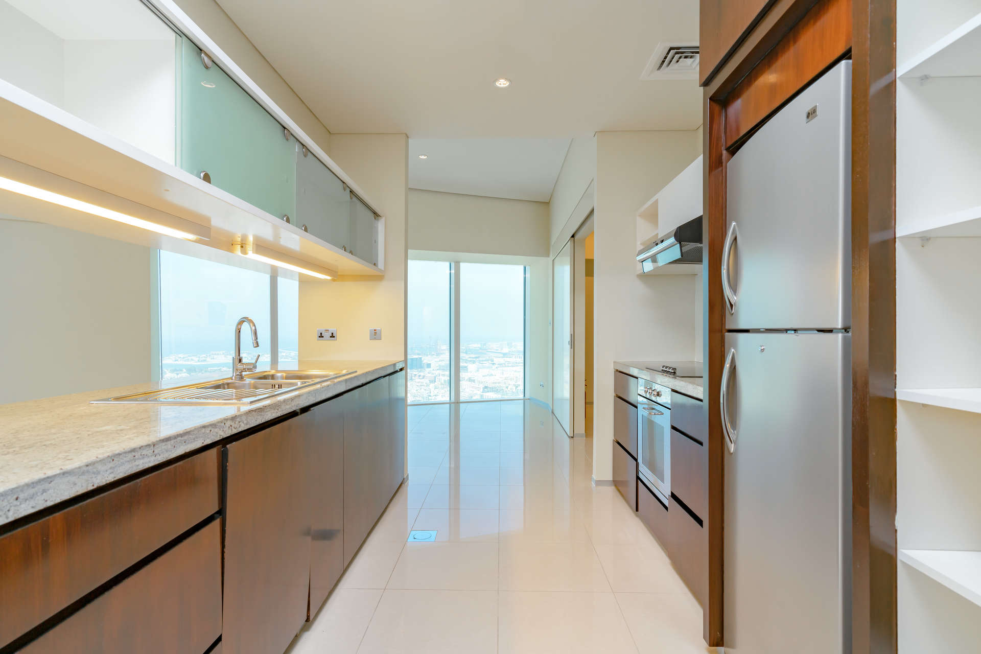 Modern kitchen with panoramic city views in Park Place Tower apartment, Sheikh Zayed Road
