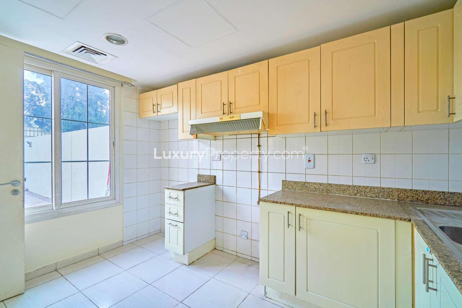 Empty bedroom with tiled floor and built-in wardrobe in The Springs villa for rent