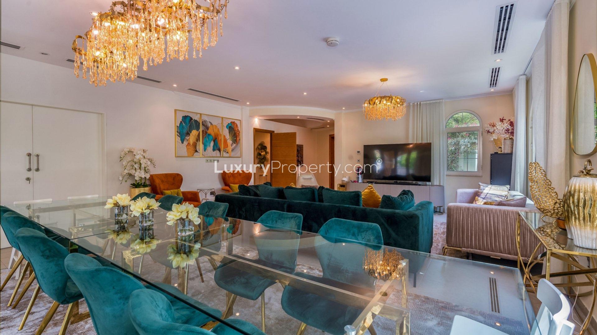 Luxurious living room in Legacy Villa, Jumeirah Park, with elegant decor and garden view