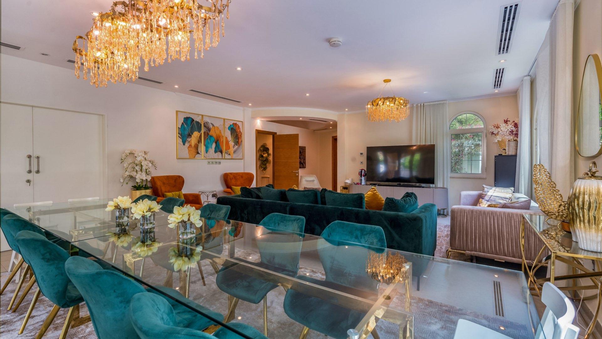 Luxurious living room in Legacy Villa, Jumeirah Park, with elegant decor and garden view