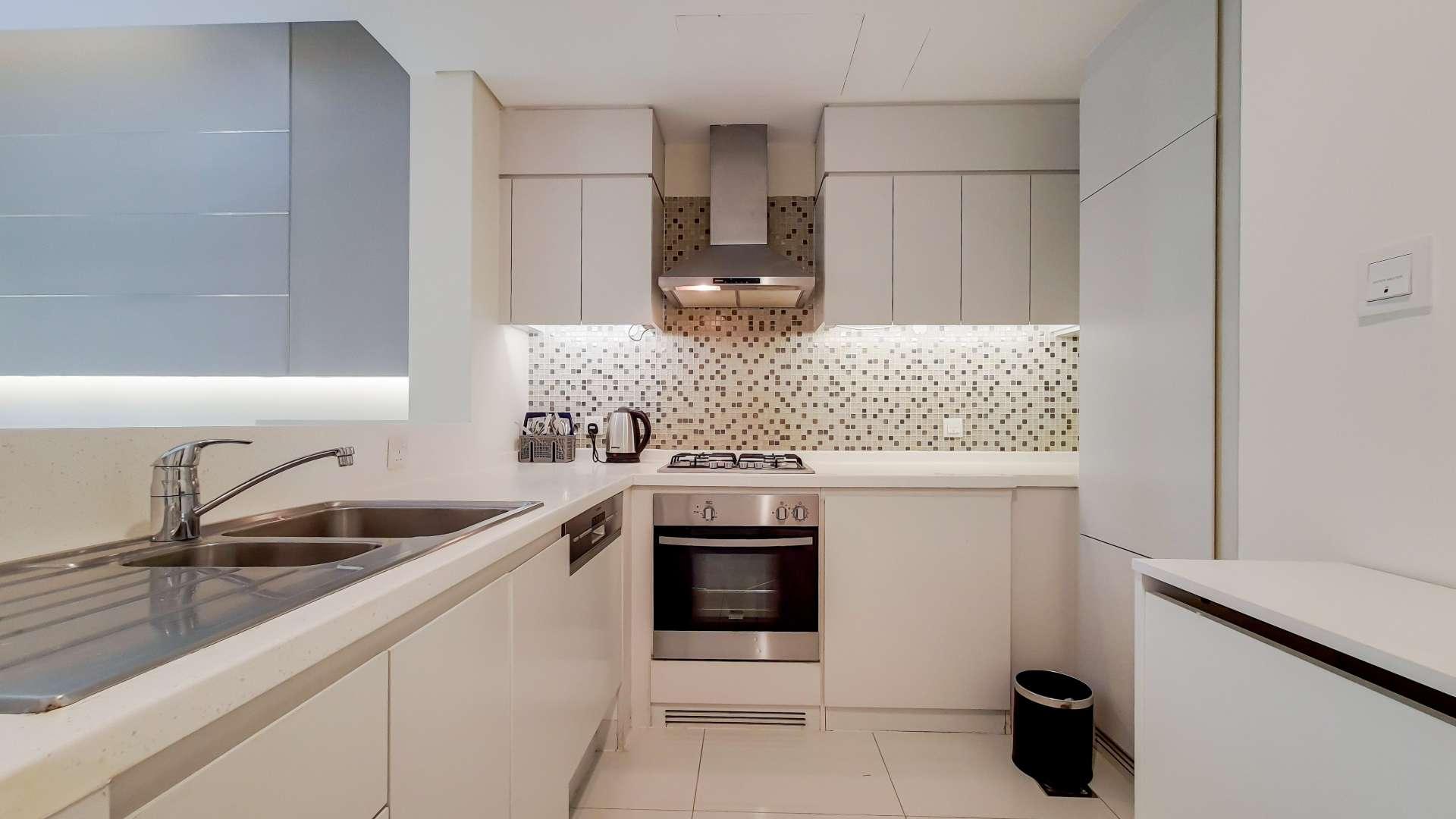 Modern living room with skyline views in Business Bay apartment for rent