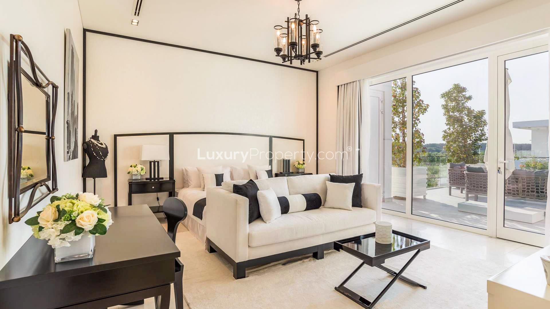 Modern five-bedroom villa exterior with lush greenery in The Nest, Al Barari