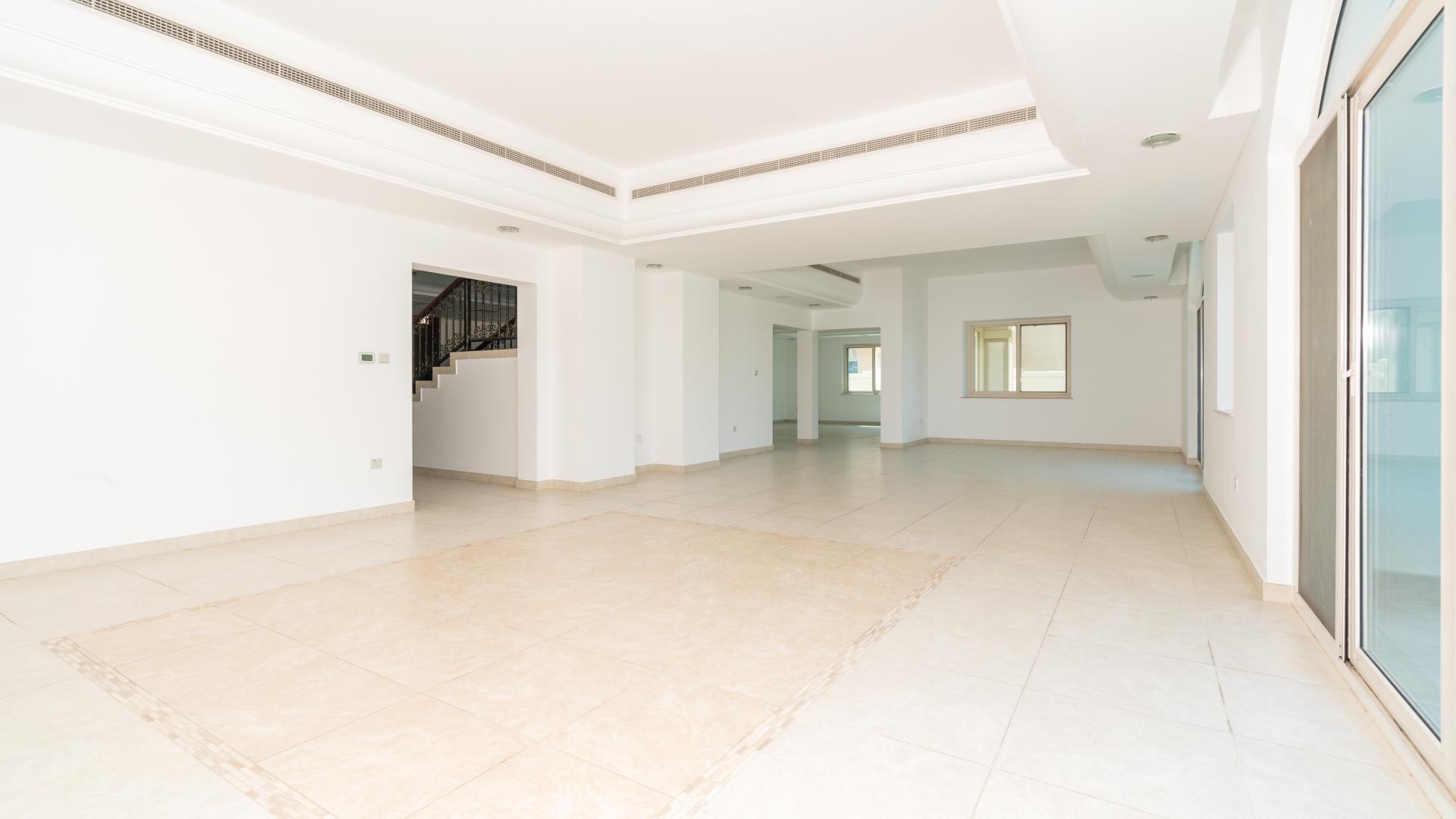 Spacious living area with garden views in Victory Heights villa, Dubai Sports City