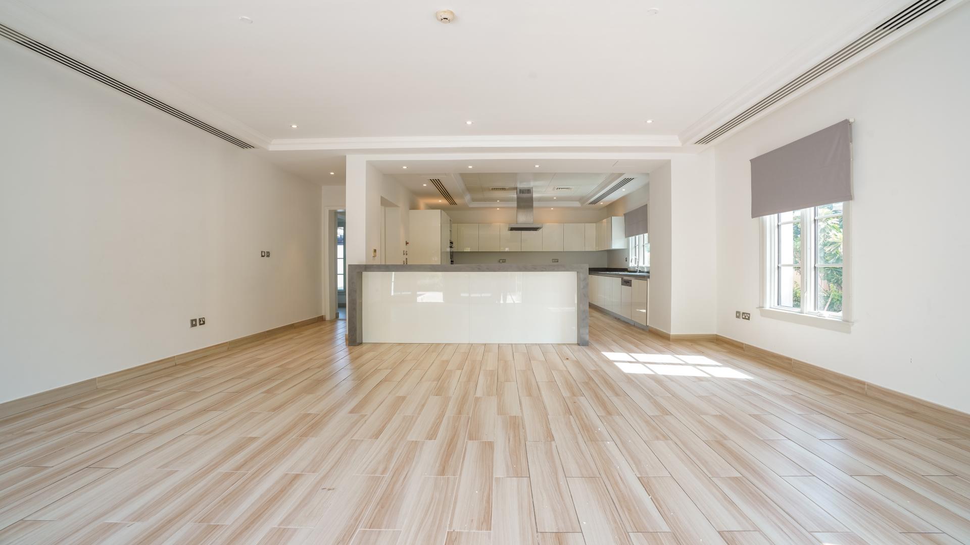 "Elegant 5-bedroom villa exterior in Jumeirah Golf Estates, Redwood Avenue, for rent.",Bright, upgraded kitchen in Redwood Avenue villa, Jumeirah Golf Estates, available for rent