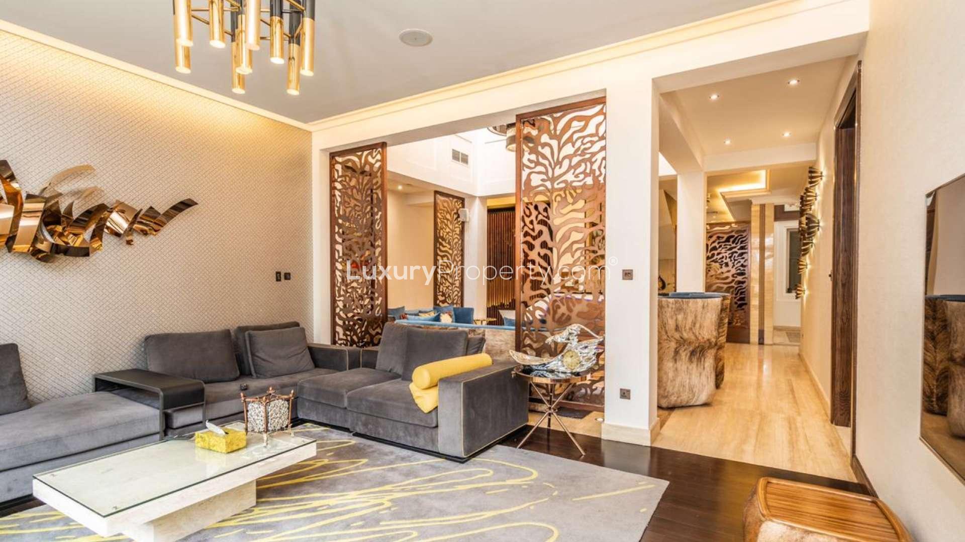 Modern living room in 6-bedroom villa, Acacia, Al Barari, featuring stylish decor and cozy seating