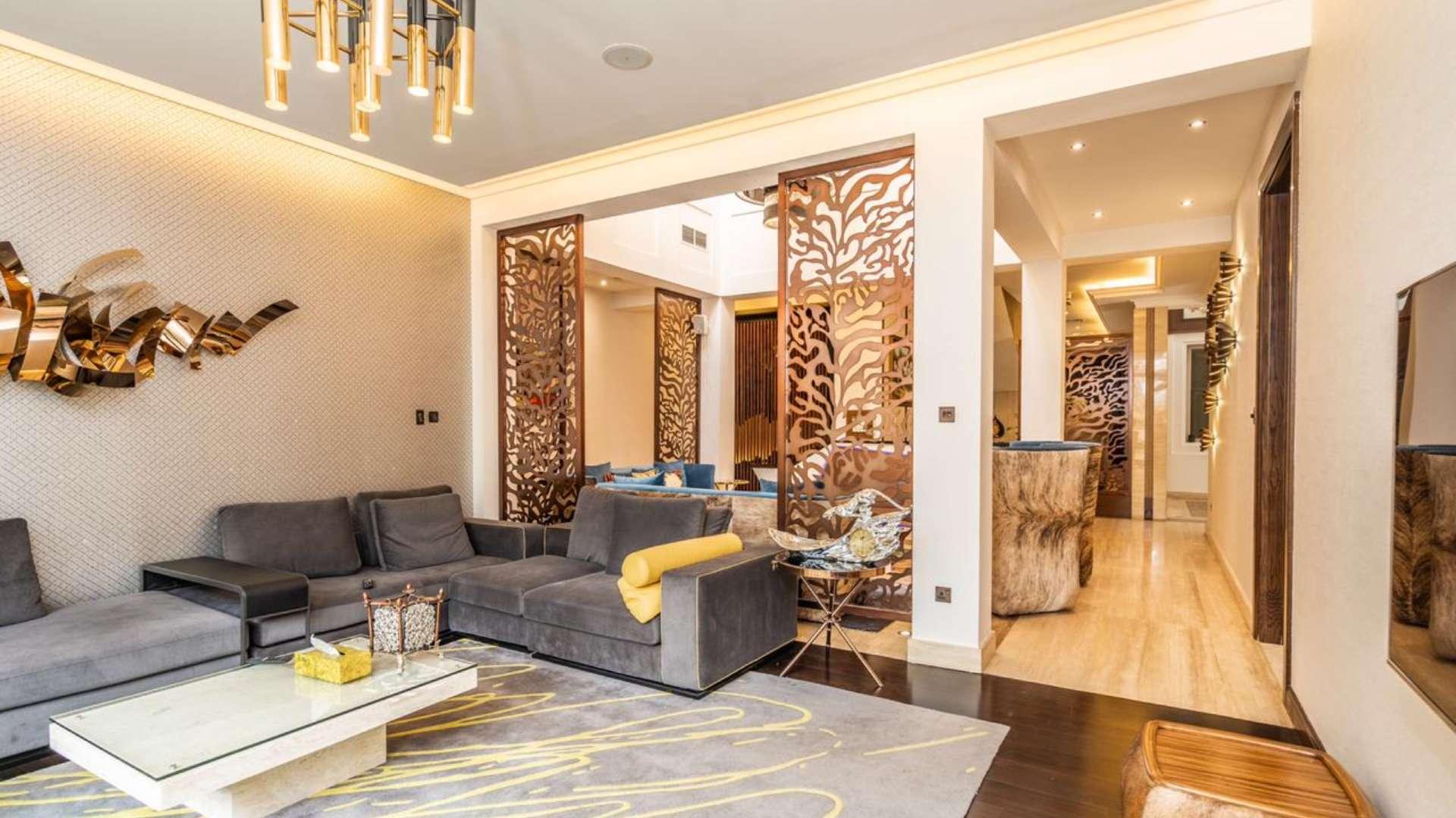 Modern living room in 6-bedroom villa, Acacia, Al Barari, featuring stylish decor and cozy seating