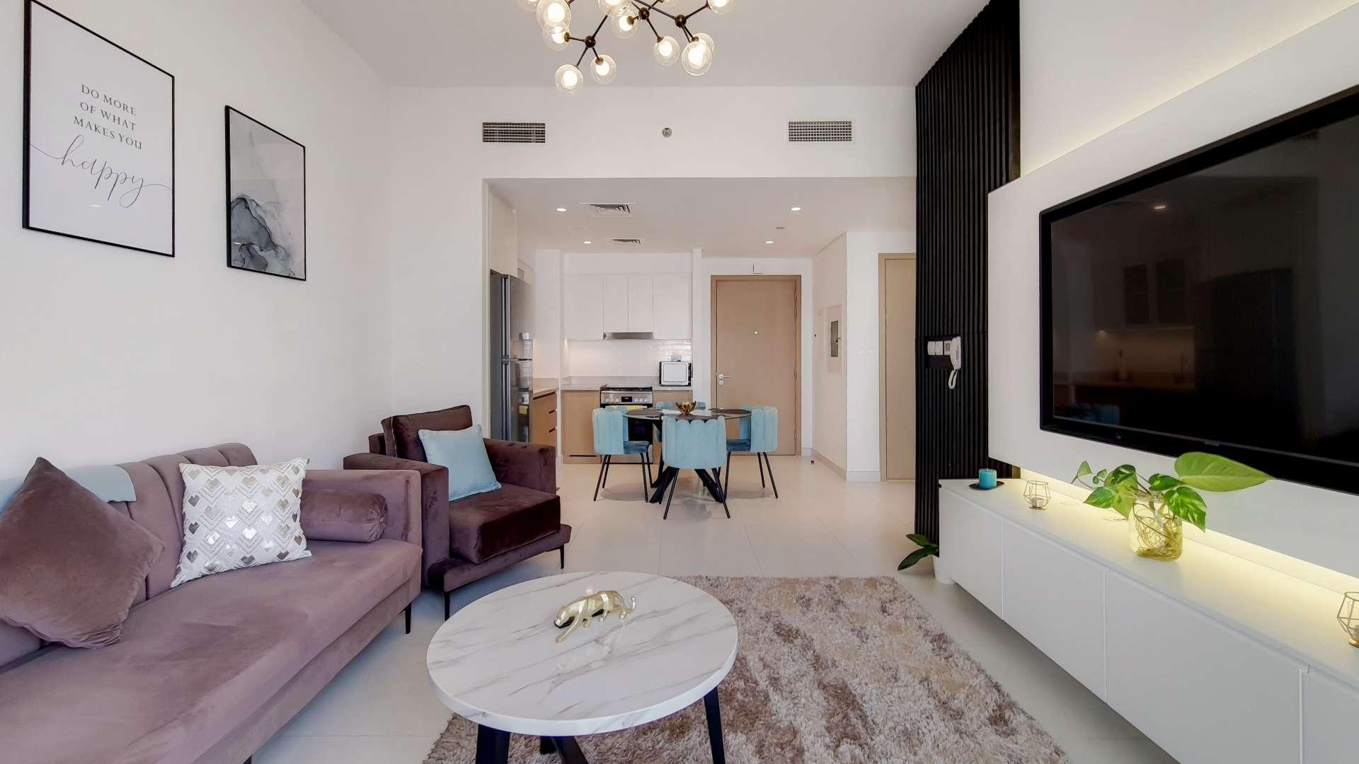 Furnished waterfront apartment living room with balcony view in Creekside 18 for rent