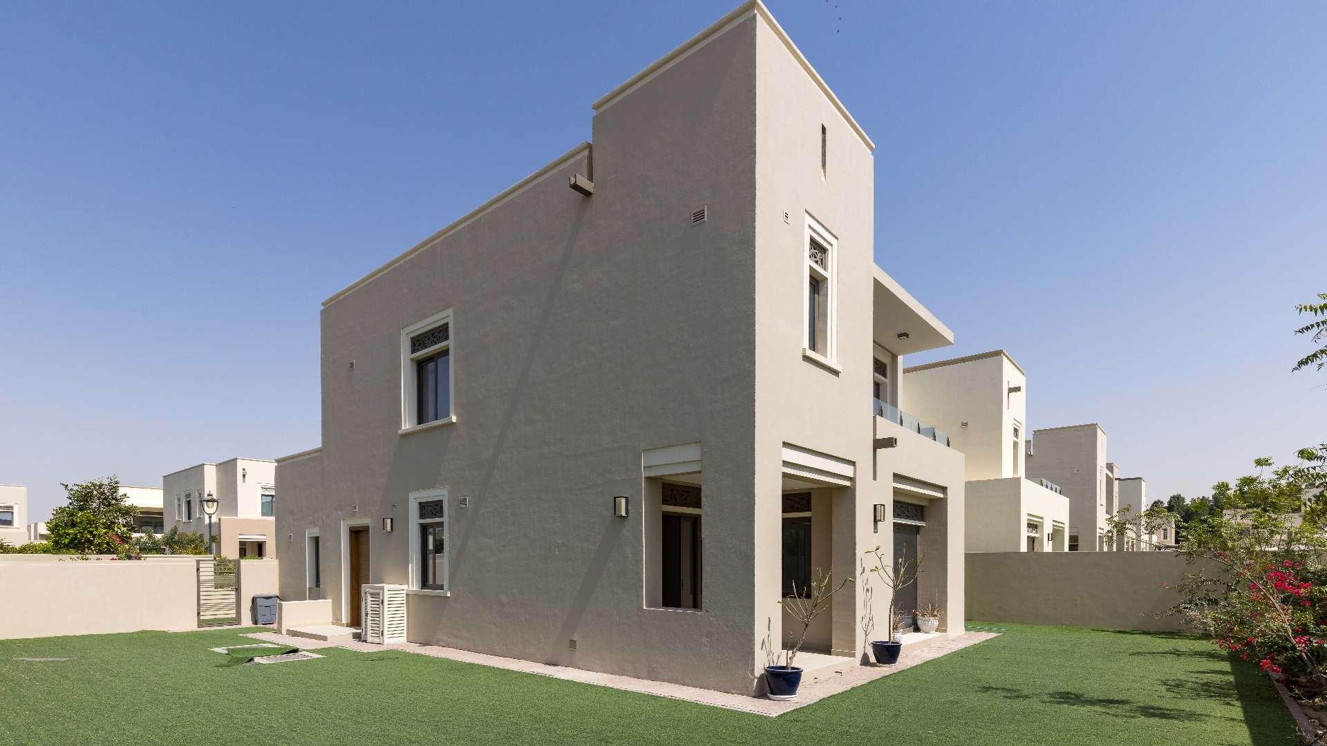 Bright living area with large windows, overlooking garden in Azalea, Arabian Ranches 2 villa