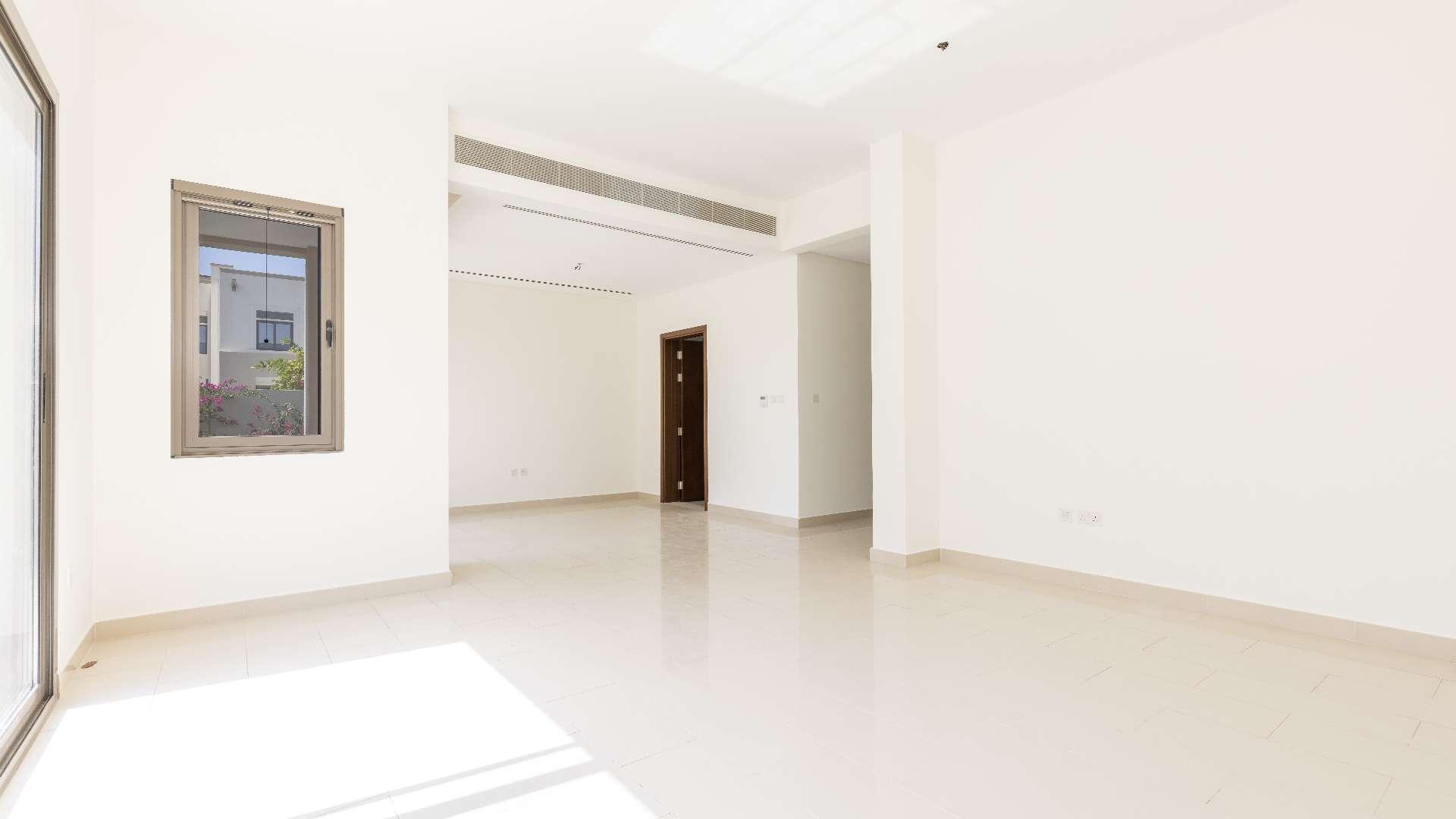 Beautiful villa exterior in Azalea, Arabian Ranches 2, featuring lush garden and spacious design