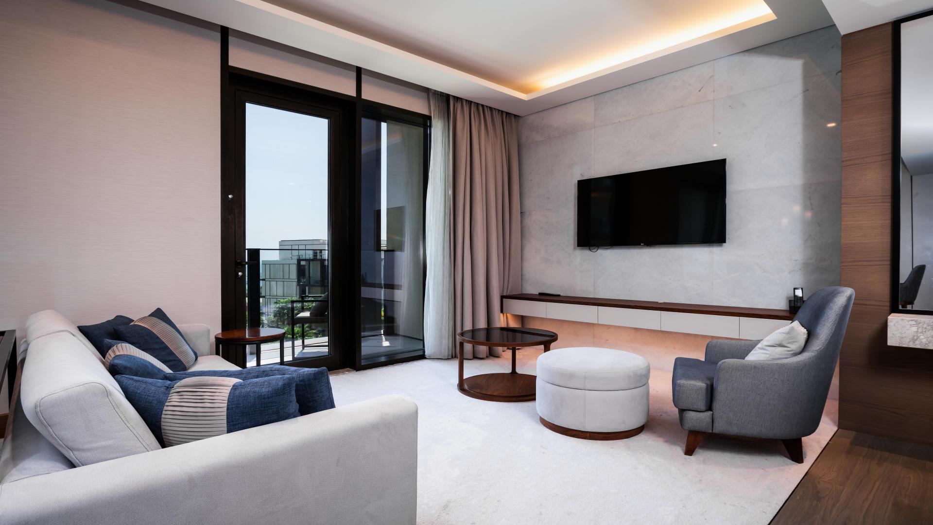 Balcony view from luxurious 1-bedroom apartment in Caesars Bluewaters Dubai, overlooking cityscape