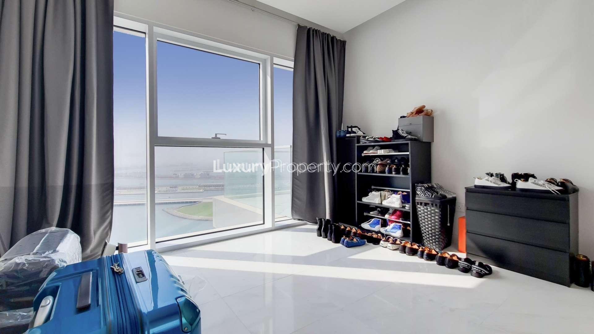 Contemporary living room in high-floor Palm Jumeirah apartment with modern furnishings and decor
