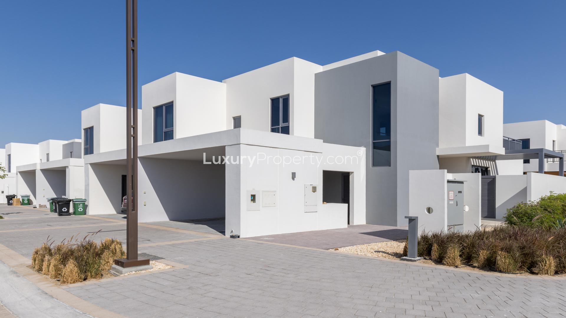 Alt text: "Bright room with large windows in Maple 3 townhouse, Dubai Hills Estate.",Modern 4-bedroom townhouse with terrace in Maple 3, Dubai Hills Estate, for rent