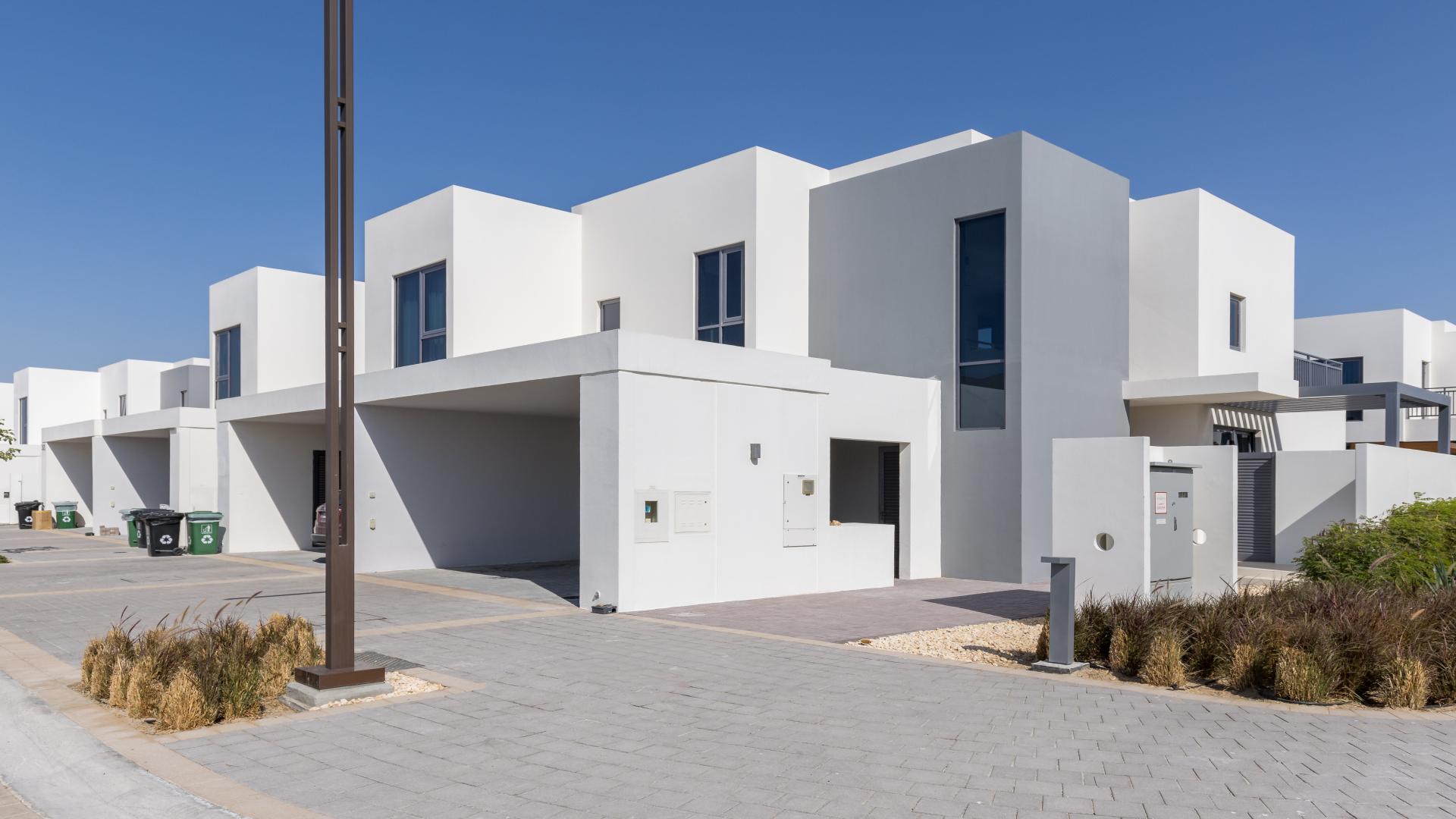 Alt text: "Bright room with large windows in Maple 3 townhouse, Dubai Hills Estate.",Modern 4-bedroom townhouse with terrace in Maple 3, Dubai Hills Estate, for rent