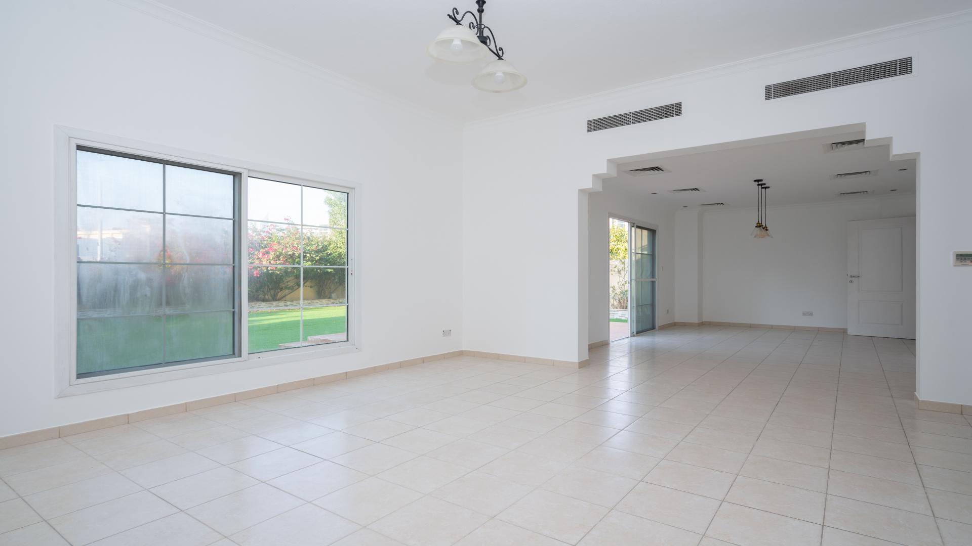 "Spacious villa interior with garden view in Meadows 9, available for rent. Ref: LP16042.",Spacious villa interior in Meadows 9 with tiled floors and modern kitchen, available for rent