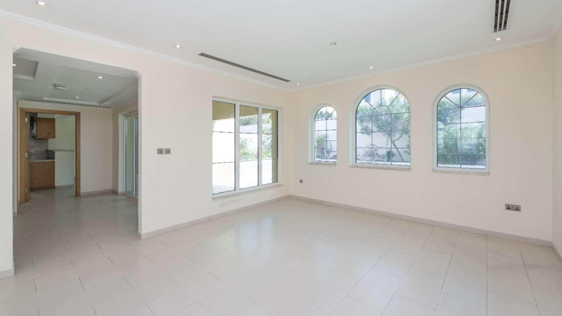 "Jumeirah Park Legacy villa with pool, 3 bedrooms, for rent, District 5, Dubai.",Bright living area in Jumeirah Park villa, large windows, tiled floors, open layout