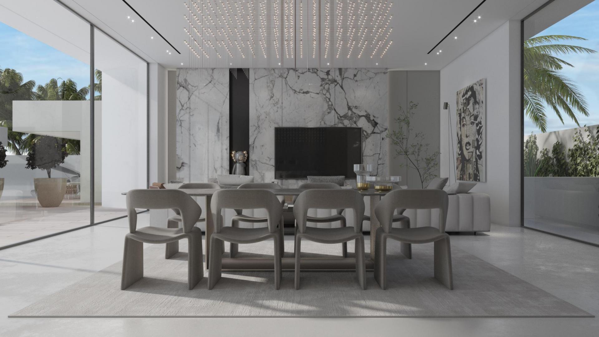 Luxurious kitchen and dining area in Dubai Hills Estate villa with garden view