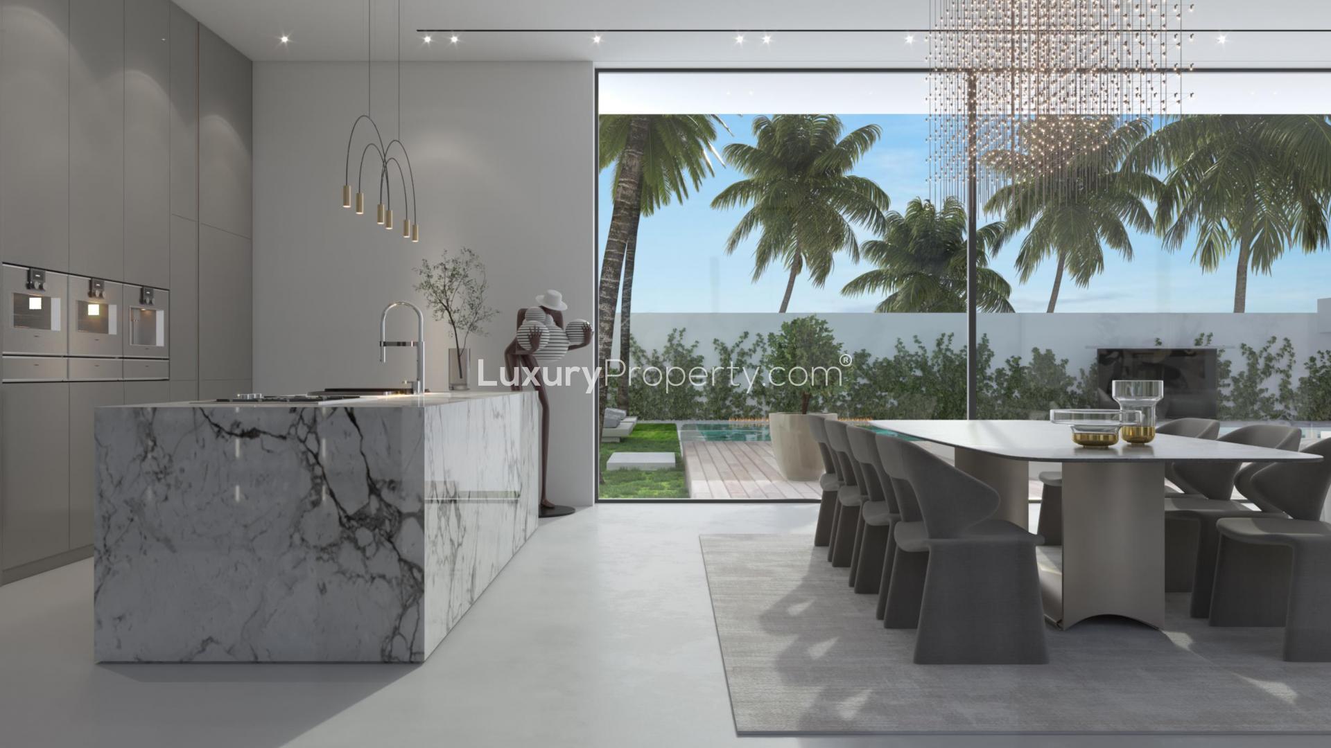 Luxurious villa pool area in Dubai Hills Estate with modern outdoor seating and palm trees