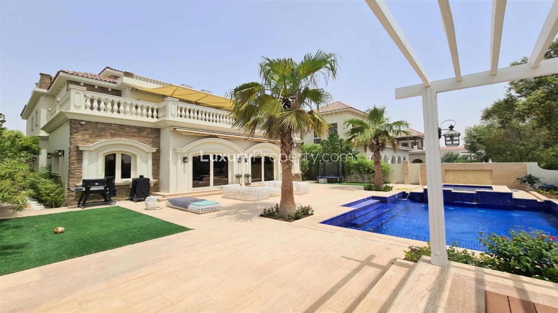 Stunning 6-bed villa exterior with lush garden, Jumeirah Golf Estates, Earth community