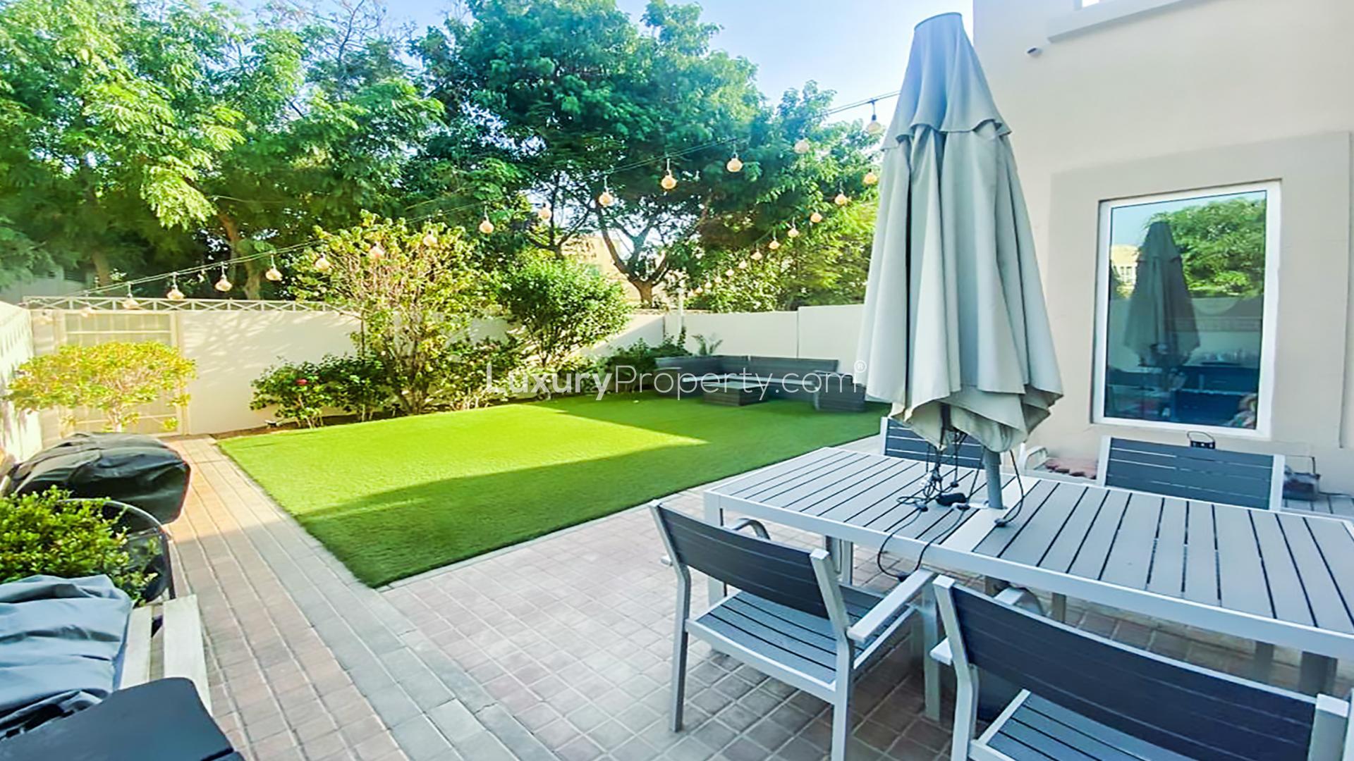 Outdoor view of upgraded villa with spacious garden in Maeen, The Lakes community