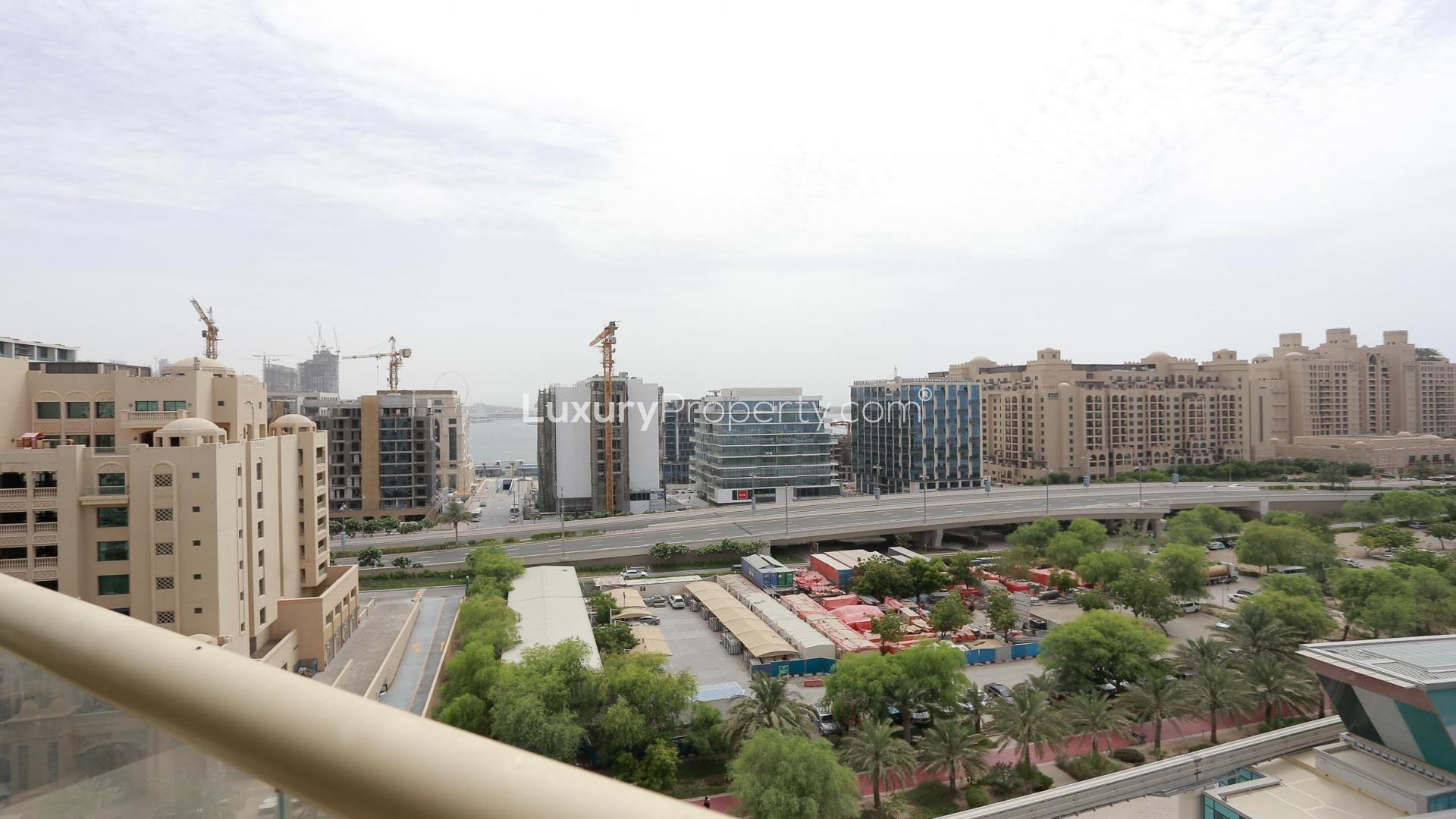 High-floor view from Shoreline Apartments, Palm Jumeirah, showcasing surrounding buildings and greenery