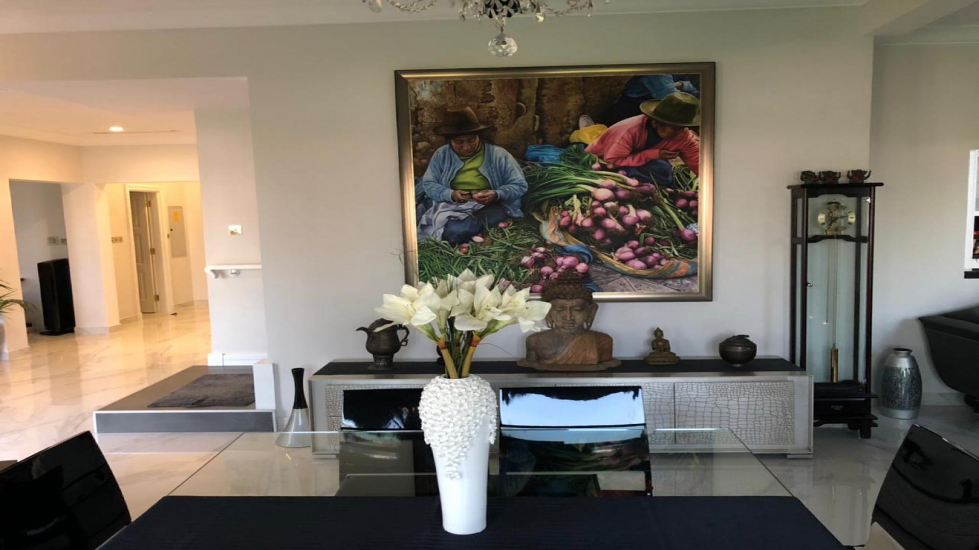 "Spacious living area in 3-bedroom beachfront villa, Palm Jumeirah, Canal Cove Villas.",Interior of 3-bedroom beachfront villa in Palm Jumeirah, featuring elegant decor and artwork
