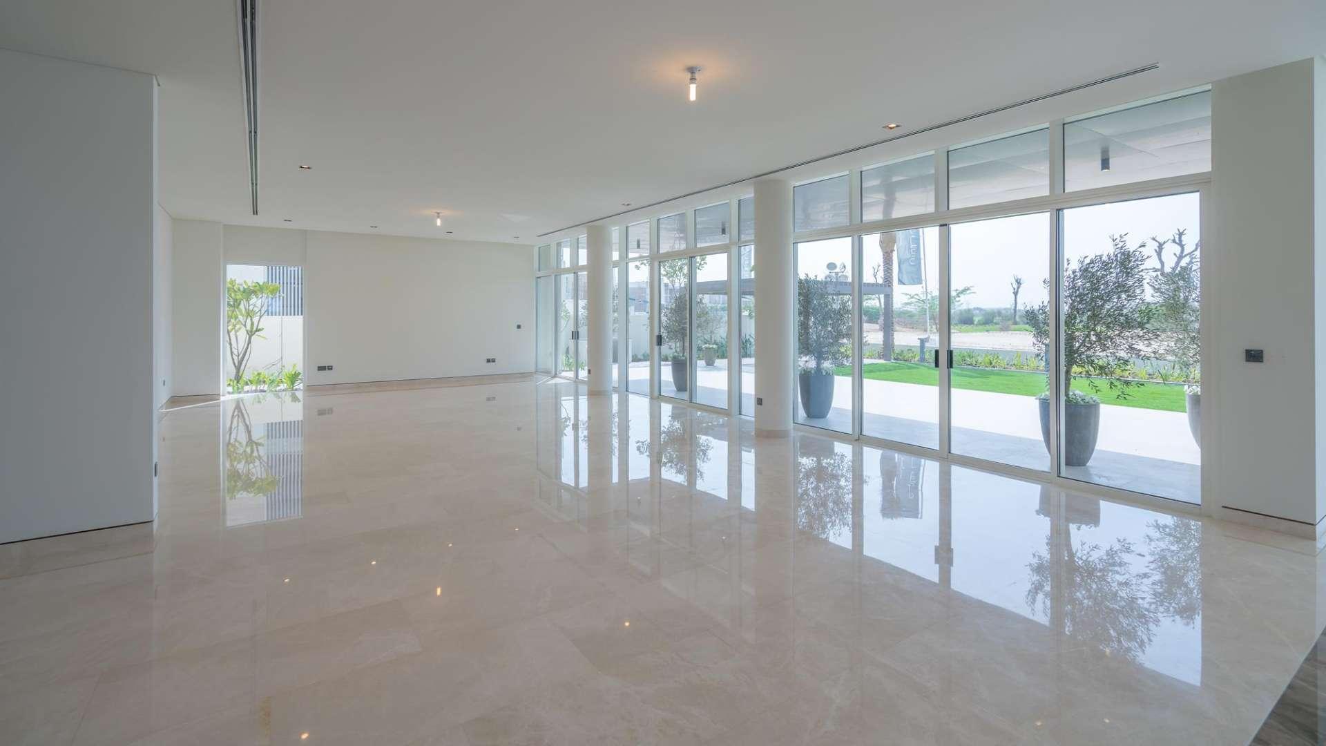 "Spacious entrance of 4-bedroom villa in Golf Place, Dubai Hills Estate, with modern design.",Bright, spacious living area with floor-to-ceiling windows in Golf Place villa, Dubai Hills Estate