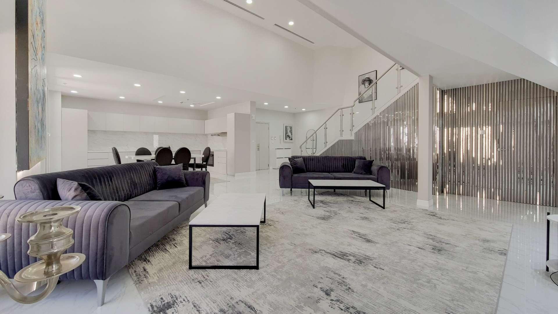 Luxurious designer loft living room in JBR Sadaf, featuring modern furniture and elegant decor