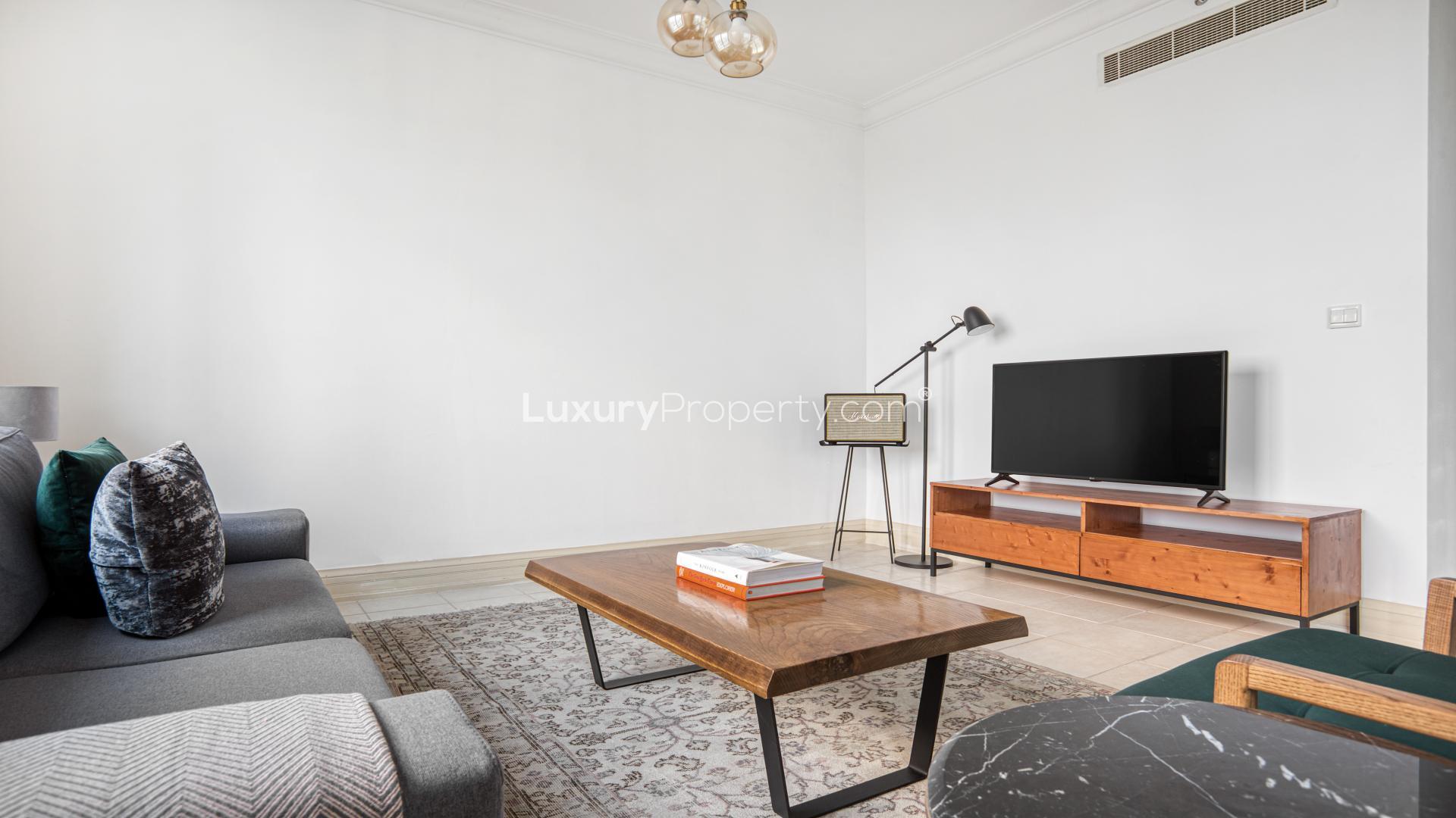 Dubai Marina apartment view with Emaar 6 Towers and golf course in the background