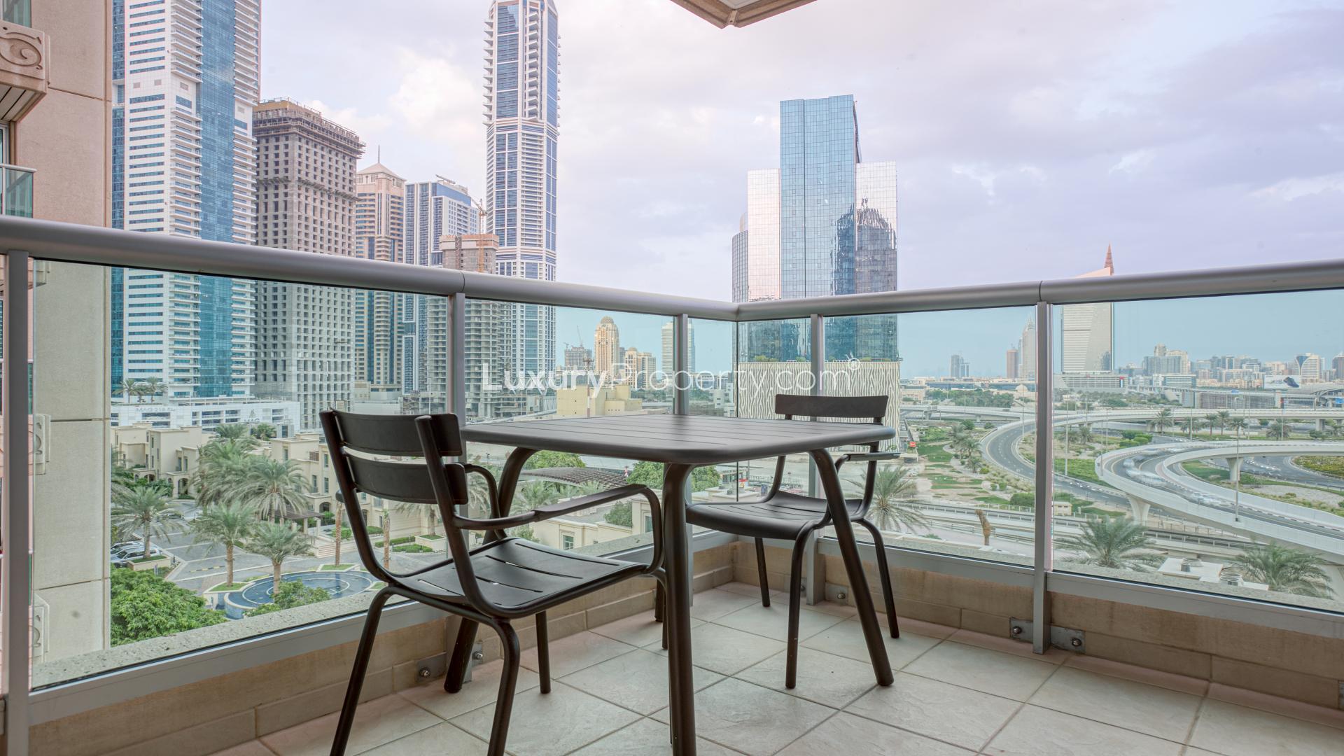 Modern living room with balcony view in Dubai Marina apartment, Emaar 6 Towers
